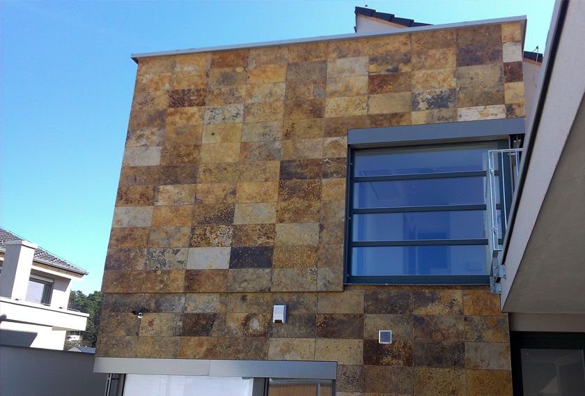 A house clad in Carioca Bronze Quartzite CUPA STONE