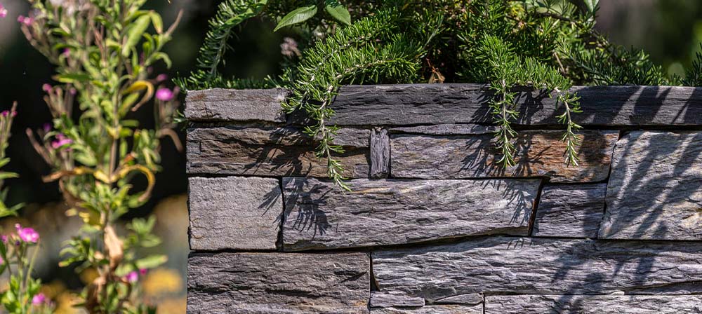 black slate wall in a garden