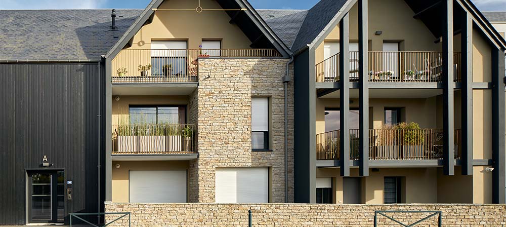 residential houses with natural stone cladding in their facade