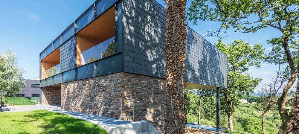 house with etics system and natural stone facade