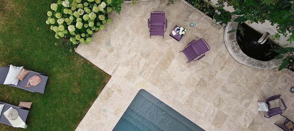 a terrace next to a pool at chateau montfort