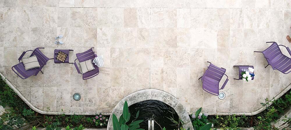 terrace with chairs and natural stone floors