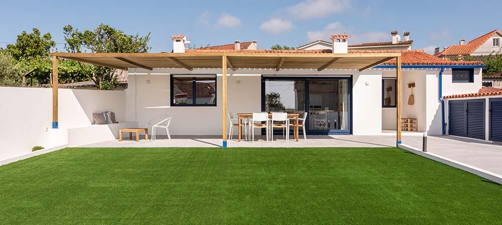 house on the coast with artificial grass