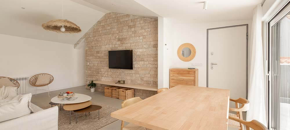 living room with cream tones and natural stone